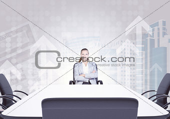 Successful businesswoman sitting at table