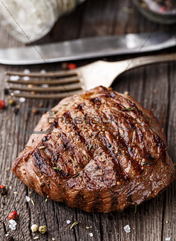 Beef steak on a wooden board