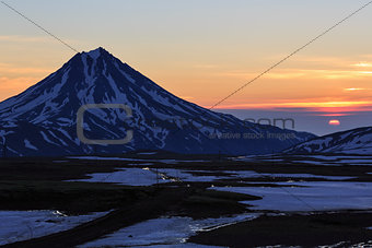 Beautiful volcanic landscape: sunrise over Viluchinsky Volcano. Kamchatka