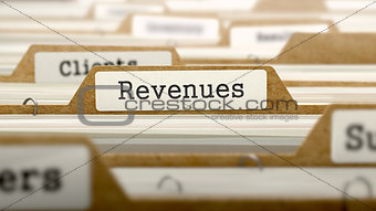 Revenues Concept with Word on Folder.