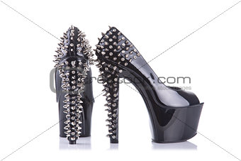 Pair of black high heel shoes with spikes 