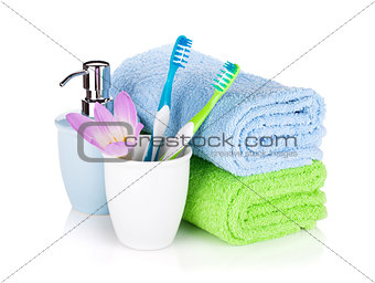 Toothbrushes, soap and two towels