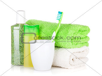 Toothbrush, cosmetics bottles and towels