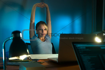 Tired Woman Interior Designer Working On PC Late At Night