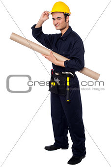 Construction worker holding building blueprint