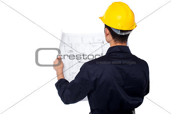 Civil engineer reviewing blueprint
