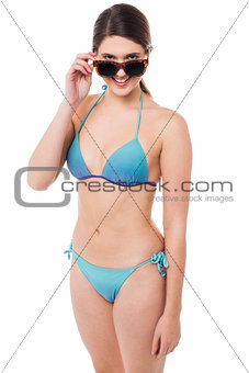 Flirtatious young babe in bikini and goggles