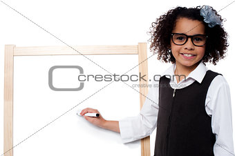 Young kid about to write on whiteboard