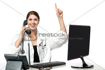 Female physician answering phone call