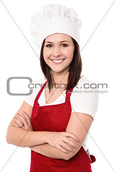 Cheerful confident young female chef