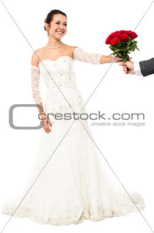 Groom presenting beautiful bride love roses