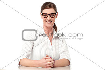 Professional woman at her desk, smiling