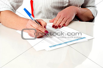 Woman reviewing and verifying employee records