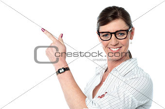 Attractive business lady pointing away