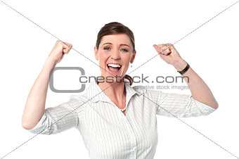 Excited corporate lady with clenched fists