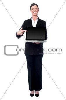 Businesswoman presenting new laptop