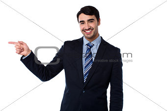 Smart businessman pointing at something