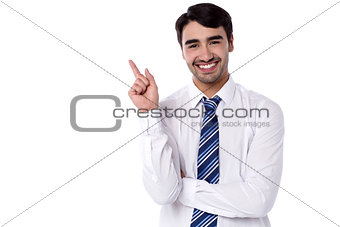 Smiling manager pointing backwards