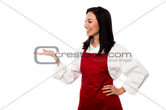 Female chef promoting bakery product