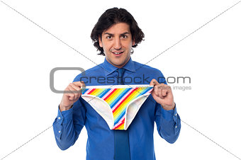 Young man holding multicolored underwear