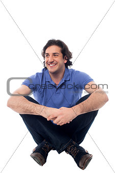 Isolated man sitting on the floor