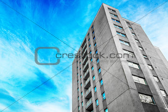 Grey tower block in the city