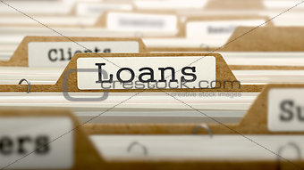 Loans Concept with Word on Folder.