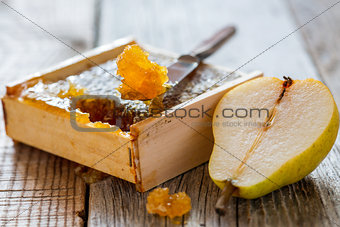 Honey comb and a slice of pear.