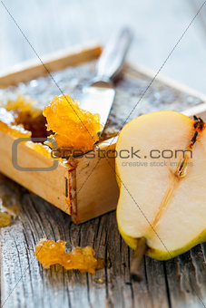Honey comb and ripe pear.