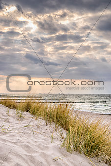 Coast of Baltic Sea with dark clouds