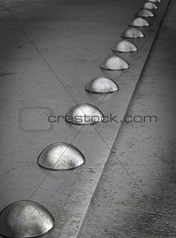 Row of rivets on the metal grunge background