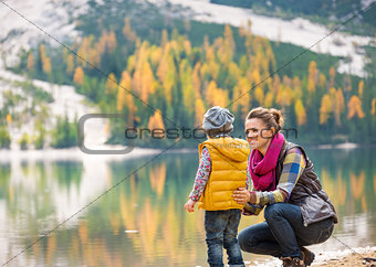 Mother speaking to daughter on the shore of Lake Bries