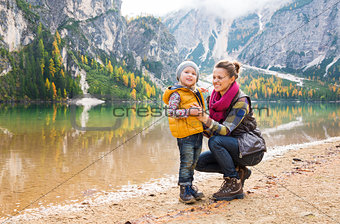 Smiling mother and daughter on the shore of Lake Bries