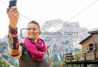 Woman on the shores of Lake Bries taking a selfie