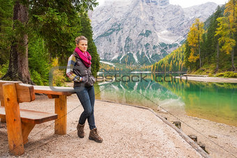 Woman hiker resting at picnic table on Lake Bries