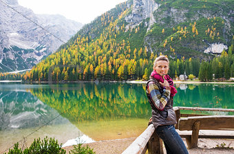 Smiling woman hiker at Lake Bries holding scarf