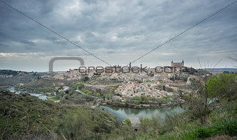 Wide angle view of Toledo with cloudy sky