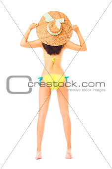  Rear view of young beautiful girl wearing summer hat and bikini