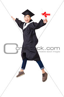 Happy  student in graduate robe jumping isolated on white