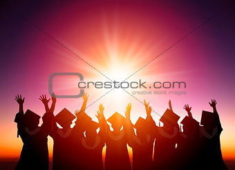 silhouette of Students Celebrating Graduation watching the sunli