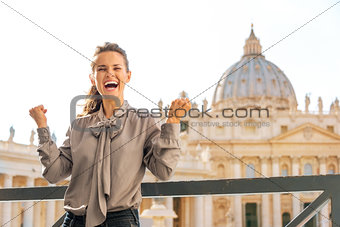 Smiling woman in Vatican City in Rome cheering and laughing