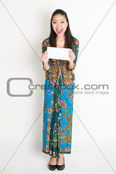 Asian female holding an envelope