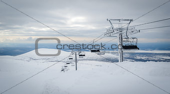 Ski lift cable way in the mountains