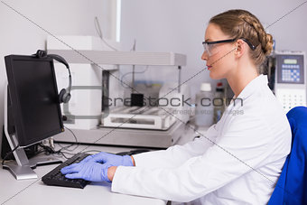 Concentrated scientist working with computer