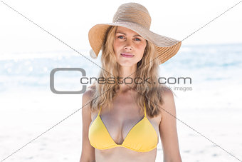 Smiling pretty blonde in bikini looking at camera