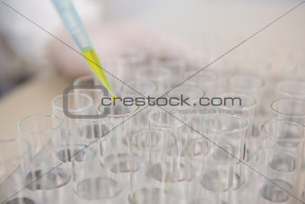Scientist injecting tubes