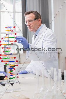 Scientist analysing dna helix