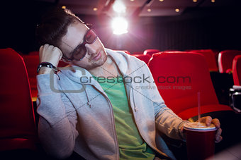 Young man sleeping in chair