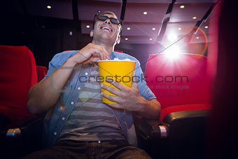 Happy young man watching a 3d film