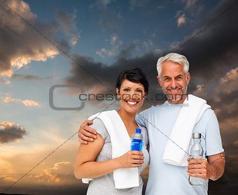 Composite image of portrait of a happy fit couple